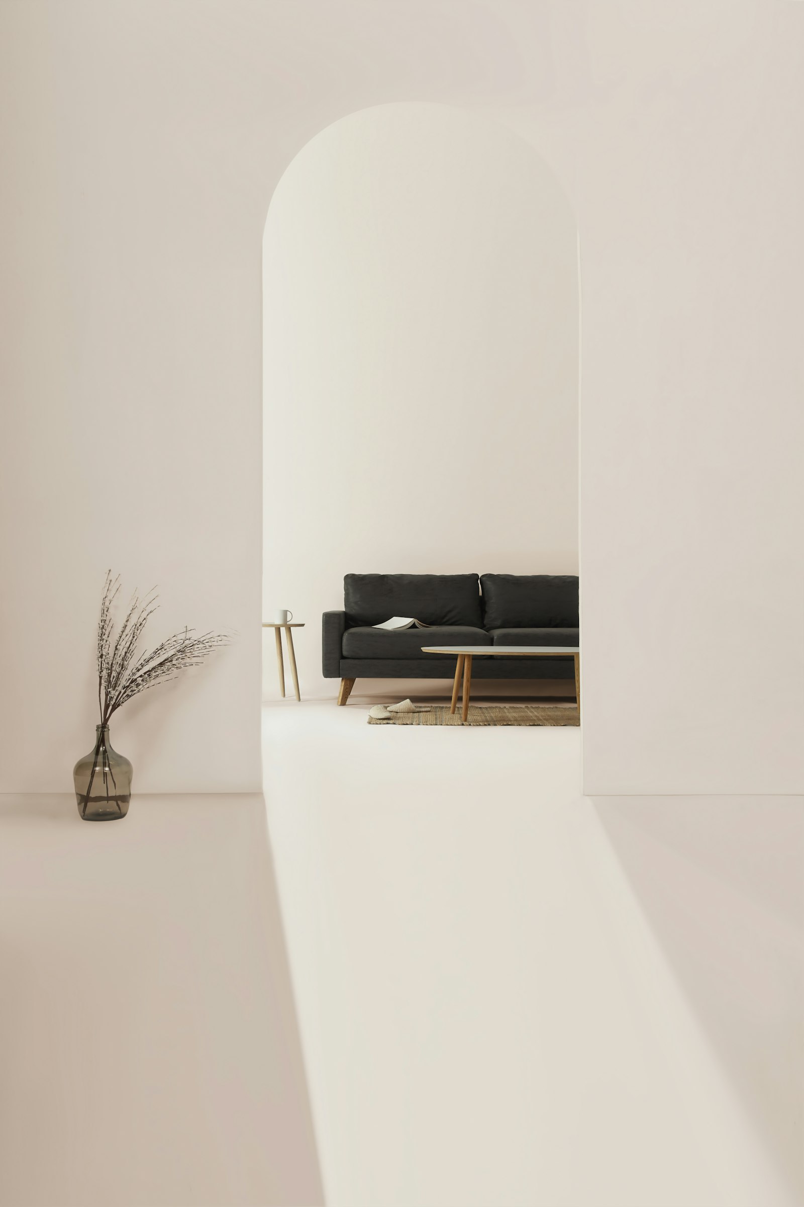 A pale room with an arched opening onto a dark sofa, a low table, and a glass vase of dried stems. It accompanies an article about Signs a website needs a revamp.